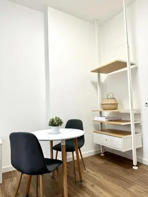 a dining room with a table and two chairs at Cozy One-Room Apartment in heart of Prague in Prague