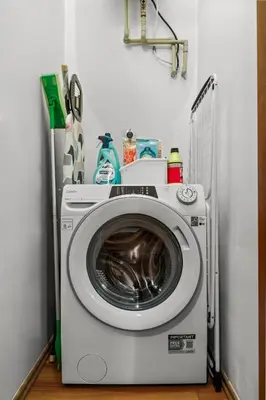 a washer and dryer in a corner of a room at Cozy stay near City Center - Žižkov in Prague