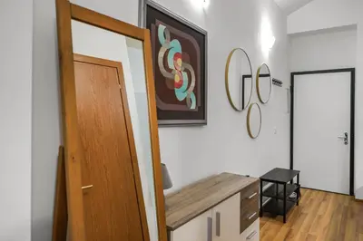 a room with a door and a picture on the wall at Cozy stay near City Center - Žižkov in Prague