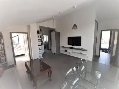 a living room with a table and a tv at Holiday Home in Kladno with Private Pool in Lány