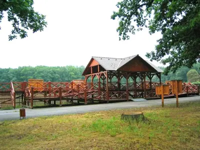 a large wooden gazebo on the side of a road at Holiday Home in Kladno with Private Pool in Lány