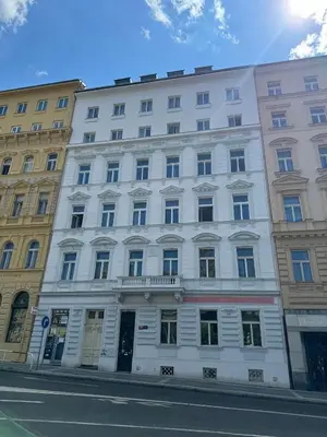 a white building on the side of a street at Elegant & Classy 1BR Apartment in Central Prague in Prague