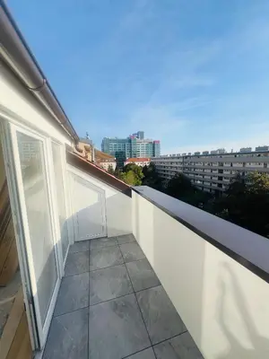 a balcony with a view of a city at New sunny rooftop apartment with a terrace 10 minutes from city centre in Prague