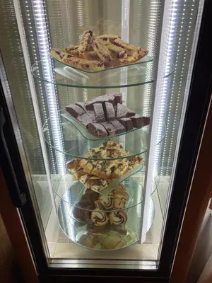 a refrigerator filled with different types of cookies at Hotel Konopiště Nová Myslivna in Benešov