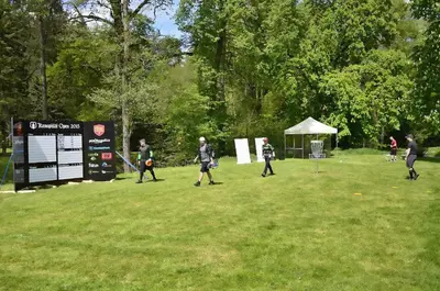 a group of people playing a game of frisbee at Hotel Konopiště Nová Myslivna in Benešov