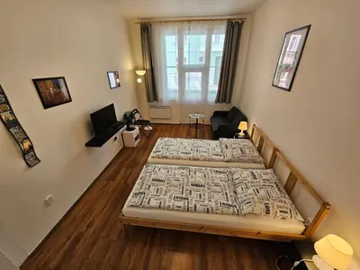 two large beds in a room with ainylinylinylinylinylinylinylinyl at Jezerka Apartments - Free Parking - Easy Access to Center in Prague