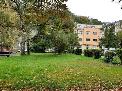 a park in front of a large building at Spacious two-room apartment in Prague in Prague
