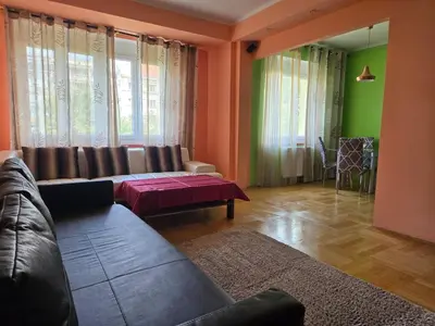 a living room with a couch and a table at Spacious two-room apartment in Prague in Prague