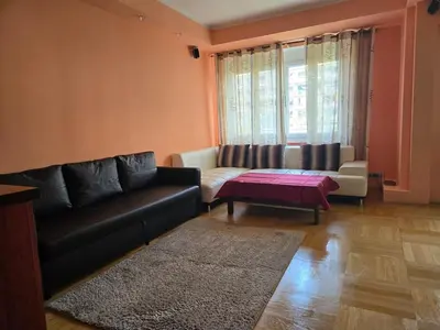 a living room with a couch and a coffee table at Spacious two-room apartment in Prague in Prague