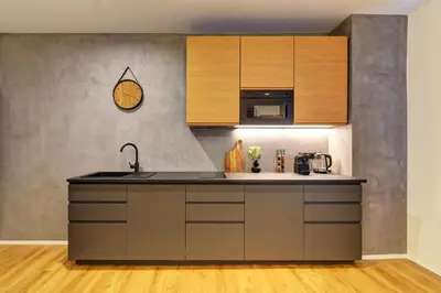a kitchen with a sink and a microwave at Long Street Deluxe Suite Apartment Prague in Prague