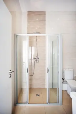 a glass shower in a bathroom with a toilet at Celebration Flat by Ruterra in Prague