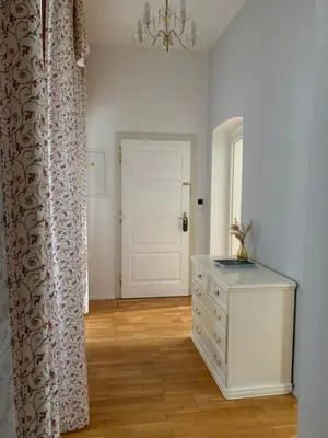 a room with a white dresser and a white door at St Wenceslas House in Prague