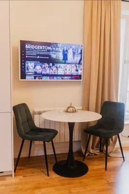 a table and two chairs in a room at Stylish Studio in the city center in Prague