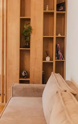 a room with a bed and a book shelf at Stylish Studio in the city center in Prague