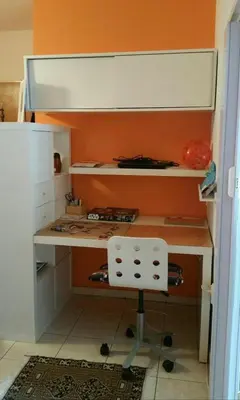 a kitchen with a desk and a stool in a room at Pleasant apartment close to city center in Prague