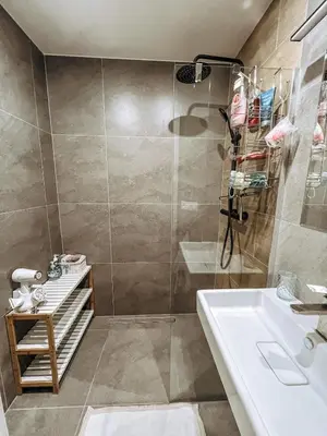 a bathroom with a shower and a sink at Stylish 1 bedroom plus office at amazing location in Prague