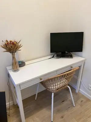 a white desk with a computer on top of it at Stylish 1 bedroom plus office at amazing location in Prague