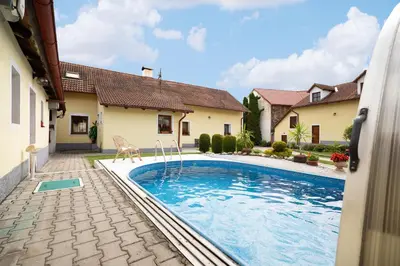 a swimming pool in the backyard of a house at Statek u Berků in Svatý Jan