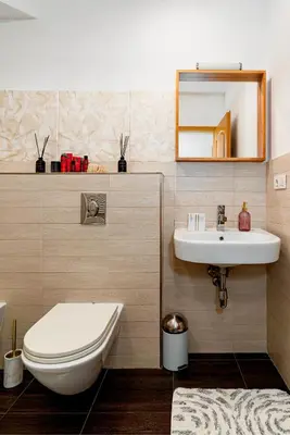 a bathroom with a toilet and a sink at Kingdom River Deluxe in Prague