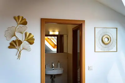 a bathroom with a sink and a mirror at Kingdom River Deluxe in Prague