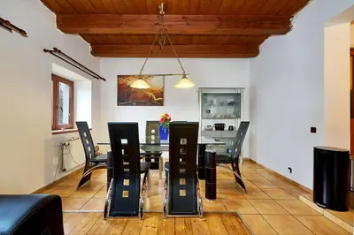 a dining room with a table and chairs at Devils Peak Prague in Prague