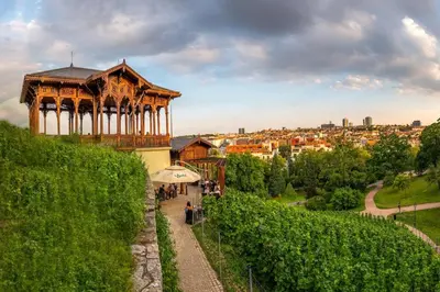 a gazebo on a hill with a city in the background at Super central Prague apartment SUPERHOST 5 stars in Prague
