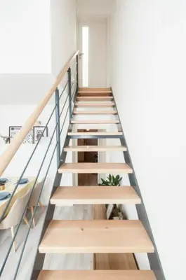 a staircase in a building with wooden steps at Kent Ridge Loft, Sokolska in Prague