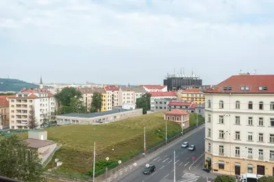 a view of a city with buildings and a street at Kent Ridge Loft, Sokolska in Prague
