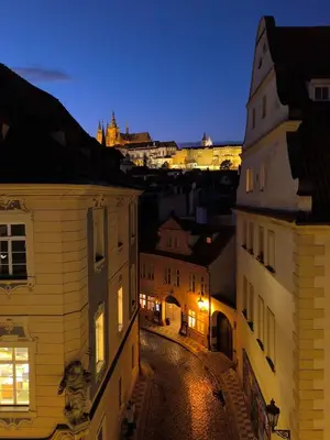 a view of a street at night with buildings at Duplex 165m2 with VIEWS only 30 Seconds to Charles Bridge in Prague