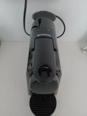 a black projector sitting on top of a table at Apartment Husova in Poděbrady