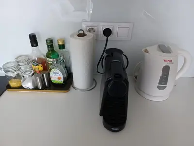 a kitchen counter with a wii remote and a blender at Apartment Husova in Poděbrady