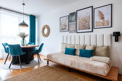 a living room with a couch and a table at Family Arena Prague in Prague