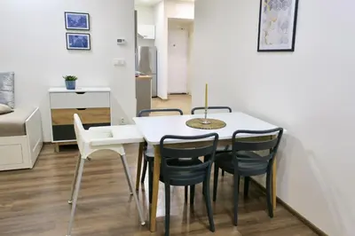 a dining room with a white table and chairs at Charm Apartment Deco near Old Town, All-Friendly in Prague