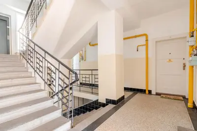 a staircase in a building with a white door at Charm Apartment Deco near Old Town, All-Friendly in Prague