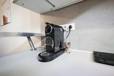 a toaster sitting on top of a kitchen counter at Charming Duplex Loft in Prague Center in Prague