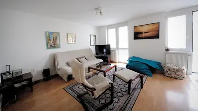 a living room with a bed and a couch at Pleasant apartment close to city center in Prague
