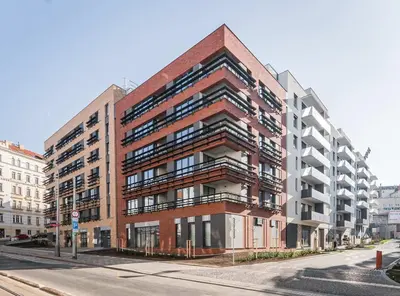 a red brick building on a city street at Viktoria Suite N6 with Garage & Balcony in Prague