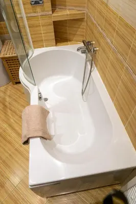 a bath tub in a bathroom with a toilet at Michalská Residence by Old Town Square in Prague