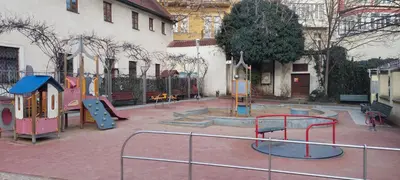 a playground with a bunch of play equipment in front of a building at Michalská Residence by Old Town Square in Prague