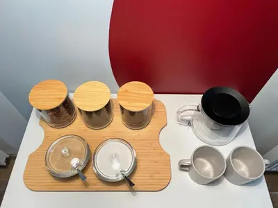 a kitchen and living room with a couch and a table at Visit Oomph Apartments in Prague