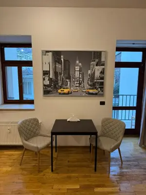 a dining room with a table and two chairs at Cosy Studio with terrace near Florenc in Prague