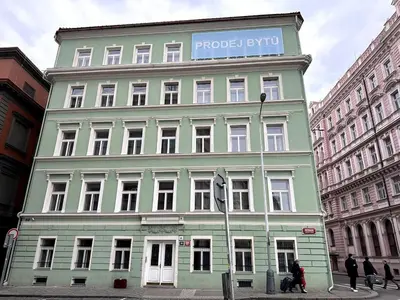 a large building with a sign on the side of it at Florenc Apartment in Prague
