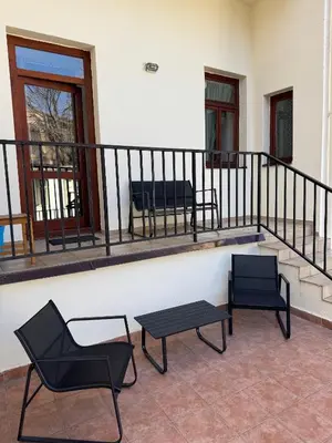two chairs and a table on a balcony at Studio - Sleeps 2 -Smoking on balcony - Pets -Wifi in Prague