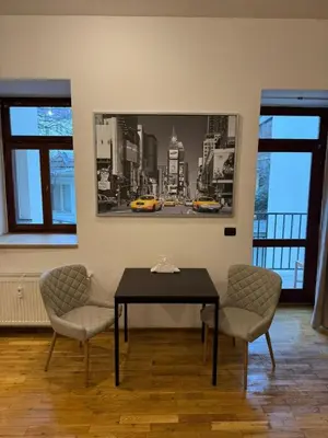 a dining room with a table and two chairs at Studio - Sleeps 2 -Smoking on balcony - Pets -Wifi in Prague