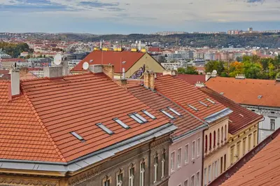 a view of roofs of buildings in a city at SOEL apartments in Prague
