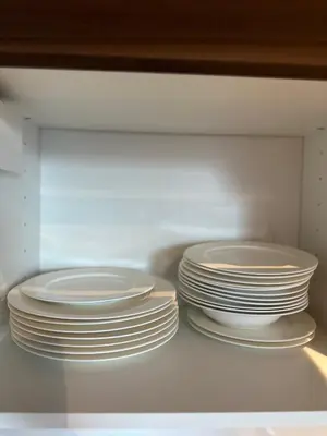 a stack of plates inside of a refrigerator at Apartamenty Liben O2 in Prague