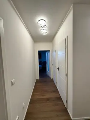 a hallway of a home with a ceiling fan at Apartamenty Liben O2 in Prague