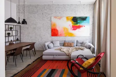 a living room with a couch and a dining room table at Spectrum Apartment in Prague