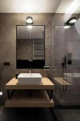 a bathroom with a sink and a mirror at Spectrum Apartment in Prague