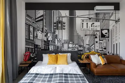 a bedroom with a black and white picture of a city at Urban Wave Apartment in Prague